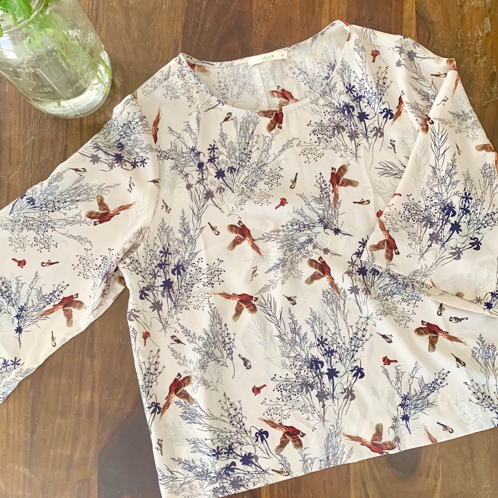 Boutique blouse. Cute with bird detail.